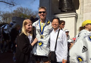 Boston Marathon finish line family hug