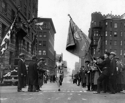 Veteran marathoner Clarence DeMar of the Melrose American Legion Post crosses the finish line April 19, 1930 in Boston, Mass., to win the Boston Marathon for the last of his record seven wins.  DeMar's time was 2:34:48.2. (AP Photo)